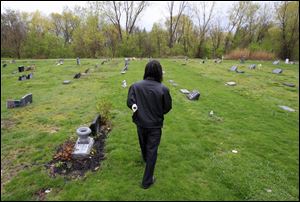 Les Robinson, leader of Parents of Murdered Children in Toledo, says he was able to find peace at his son's grave at Forest Cemetery until he learned the man who shot his son is jailed a mile away. 