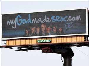 An electronic billboard on Monroe Street near Sylvania Avenue flashes a message about CedarCreek Church's sex-ed seminars.