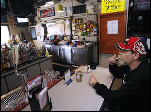 Mark Eidson is among patrons at Michigan Tavern who will be affected by Michigan's smoking ban.<br>
<img src=http://www.toledoblade.com/assets/gif/weblink_icon.gif> <font color=red><b>COMMENT</b></font>: <a href=" http://tol.bz/cb2hc9"target="_blank"><b> on The Blade's Facebook page</b></a>
