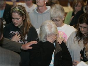 CTY nevaeh 26p   04/026/2010       The Blade/Lori King  Sherry Buchanan, center, grandmother of Nevaeh Buchanan, weeps during prayer service held at Nevaeh Buchanan Reward Poster Campaign at the Moose Lodge in Monroe, Mich.