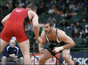 JD Bergman, right, prepares to wrestle Jake Varner at the 2010 U.S. Open freestyle championship in Cleveland last weekend.