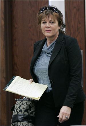 Robin Vess, above, was too depressed to care for her horses, her defense attorney says.