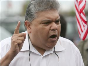 Former Toledo City Councilman Louis Escobar compared Arizona's immigration law with policies of Nazi Germany. 