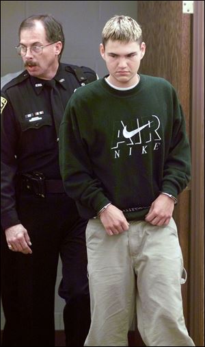 Nicholas Arvanitis, at his arraignment in 1999, posted messages threatening his school after the Columbine killings.
