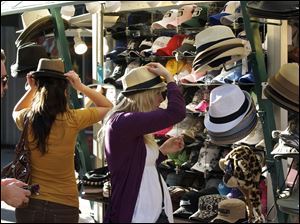 L.A. consumers try on hats. New data show a cooloff in April but a good spring season overall for retailers, especially wholesale clubs such as Costco and luxury retailers such as Nordstrom Inc.