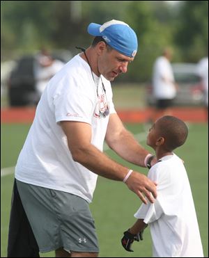 Chris Spielman's campers are too young to have seen him play, but he has a presence that gets their attention and motivates them.