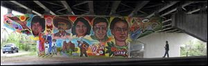 Frida Kahlo, right, is among the local and international heroes depicted on the mural, which took 10 days to complete and involved area residents, artists, students, and teachers.
<br>
<img src=http://www.toledoblade.com/graphics/icons/photo.gif> <font color=red><b>PHOTO GALLERY</b></font>: <a href=