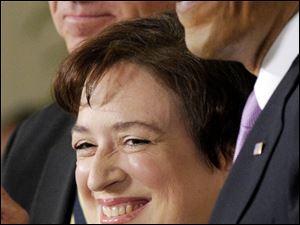Elena Kagan, flanked by Vice President Joe Biden and President Obama is the solicitor general.