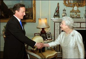 Britain's Queen Elizabeth II greets David Cameron, the leader of the Conservative Party, at Buckingham Palace, London, in an audience to invite him to be the next Prime Minister of the United Kingdom, following last week's General Election, Tuesday.