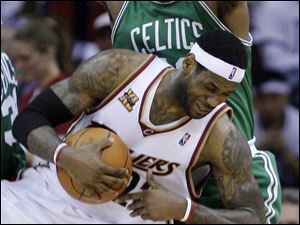LeBron James, being fouled by Boston's Glen Davis, had just 15 points in a Game 5 loss.