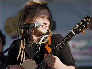 Crystal Bowersox wears a big smile as she performs along with bassist Frankie May for a home crowd of 5,000 at the Ottawa County Fairgrounds. The concert came amid a whirlwind day, including a visit with family members in her hometown of Elliston, Ohio, and performances at Levis Square and Fifth Third Field in downtown Toledo.
<br>
<img src=http://www.toledoblade.com/graphics/icons/photo.gif> <font color=red><b>PHOTO GALLERY</b></font>: <a href="/apps/pbcs.dll/gallery?Avis=TO&Dato=20100512&Kategori=ART22&Lopenr=514009997&Ref=PH"target=_blank"><b>Crystal returns home</b></a>