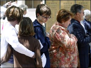 Keith Dressel's sister, Jennifer Raburn, left; niece Riley Raburn; nephew Canyon Raburn, and his mother and father, Larraine and Michael Dressel, attend the ceremony for slain police officers. 