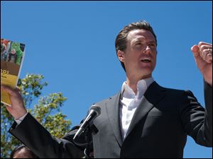 San Francisco Mayor Gavin Newsom, announcing a summer camp program, says the charter government enables the city-county to respond effectively to financial and institutional woes.