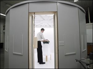 Jeff Nissen places tortoises in a TechTol Imaging studio that produced three-dimensional images of the reptiles within seconds. The company plans educational and security uses for its technology. 