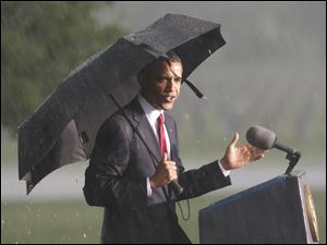 President Obama begins his Memorial Day remarks at the Abraham Lincoln National Cemetery in Elwood, Ill., before a fierce rainstorm canceled yesterday's observance.