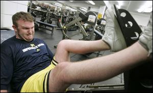 Brock Mealer, 25, works on his rehabilitation at the University of Michigan's football weight training facility inside Schembechler Hall in Ann Arbor.
<br>
<img src=http://www.toledoblade.com/graphics/icons/photo.gif> <font color=red><b>PHOTO GALLERY</b></font>: <a href=