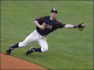 Toledo second baseman Scott Sizemore snags a ground ball, but Chris Duffy beat Sizemore's throw to first base.