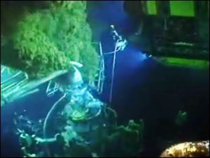 In this image from BP video, robots and other equipment swarm the site of the leak, bottom left. The diamond-tipped saw that was cutting the pipe snagged and it took crews 12 hours to free it.