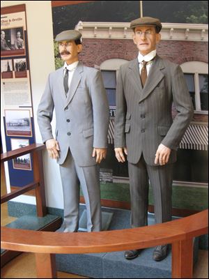 Animatronic figures of Orville, left, and Wilbur Wright greet visitors to Carillon Historical Park in Dayton.