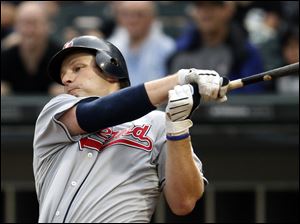 Cleveland's Austin Kearns knocks out a one-run single against the White Sox in the fourth inning and scored on a balk. Mitch Talbot pitched strong seven innings to help his team win. Cleveland's starter Mitch Talbot delivers against the White Sox, outpitching Jake Peavy for the second time this season. 