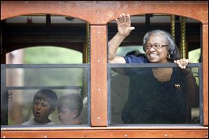 Rose Keetion waves to parade-watchers from the Elmore Trolley.
<br clear=all>
