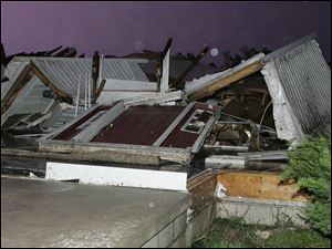 Ashley Mock, 13, was at Donna Mills' house on County Road 7 when the twisters plucked her out of the home. She survived.