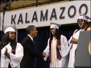 President Obama arrives to address grads of Kalamazoo Central High School, winner of the 2010 Race to the Top High School Commencement Challenge. Mr. Obama as speaker was the prize.