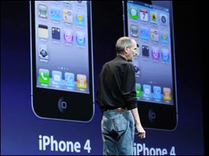 Apple Inc. CEO Steve Jobs addresses software developers in front of a projection of the new iPhone 4's pricing.