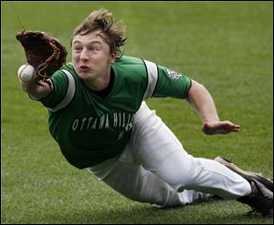 Ottawa Hills outfielder Kyle Jarecki almost comes up with a sliding catch against Fort Loramie. It was the eighth state strip for the Green Bears. 