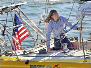 Abby Sunderland, 16, looks out from her sailboat, Wild Eyes, as she leaves for her world record attempting journey at the Del Rey Yacht Club in Marina del Rey, Calif., in this Jan. 23 file photo.