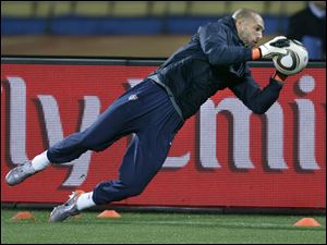 U.S. team goalkeeper Tim Howard gets a workout yesterday at the Royal Bafokeng Stadium in Rustenburg, South Africa.