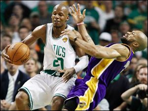 The Celtics' Ray Allen crashes into the Lakers' Derek Fisher while looking for a little space in the third quarter. Allen had 12 points.