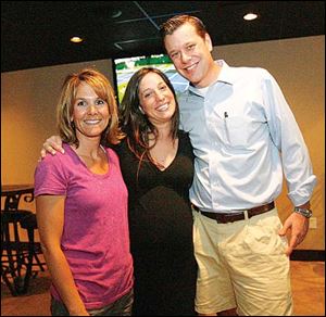 Patty Schopf, left, Erin Hirschfeld, center, and Jarrod Hirschfeld at the AdClub tennis event.