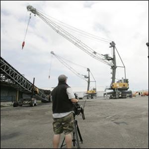 The high-speed, high-efficiency cargo cranes, named after Toledo's most prominent sports mascots, go through maneuvers at the Toledo Maritime Center. 