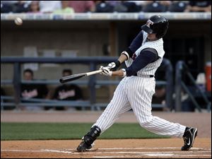 Toledo's Jeff Larish hits a three-run homer in the first inning against Norfolk.