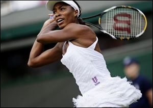 Venus Williams slams a backhand to Paraguay's Rossana de los Rios in first-round action at Wimbledon. Williams won.
