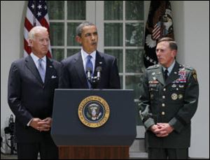 President Barack Obama announced Gen. David Petraeus, far right, as McChrystal's successor.