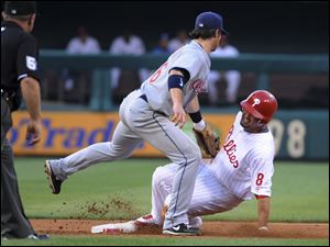 Tribe shortstop Jason Donald tags Phils' Shane Victorino during a steal attempt at second base Wednesday night.