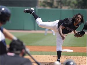 Cincinatti Reds' Edinson Volquez loses his cap as he pitches for the Louisville Bats during a rehab assignment in a game against the Toledo Mud Hens on Wednesday in Louisville, Ky. 
