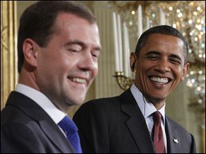 Russian President Dmitry Medvedev, left, and President Obama discussed economic issues and their differences about Russia's neighbor, Georgia.