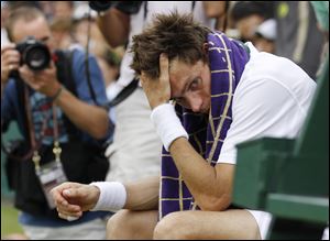 Nicolas Mahut was spent after the match, sitting alone in his chair after the three-day match.