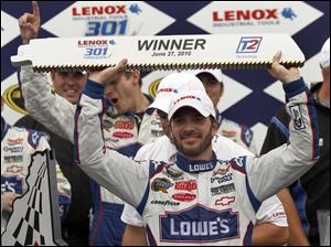 Jimmie Johnson celebrates in Victory Lane after winning the Lenox Industrial Tools 301.