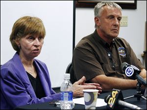 Anne Baker, left, executive director of the Toledo Zoo, and elephant expert Alan Roocroft discuss the incident Thursday in which an elephant injured a zoo worker.