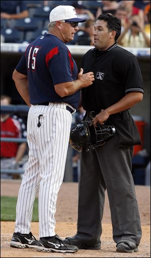 Toledo manager Larry Parrish argues with home plate umpire Manny Gonzalez after a call at the plate in the fifth inning.