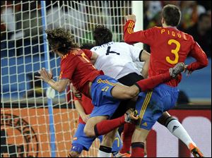 Spain's Carles Puyol sends a powerful header into the net to secure the win. Wednesday's match was a repeat of the 2008 European Championship final, when Spain won its first major title in 44 years.