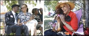 Left, newlyweds Tony and Debbie Izzard of Detroit hold hands and enjoy the music during Red, White & KABOOM!. Right, Magdalena Hinojosa holds her dachshund Lucy while waiting for her to compete in the wiener dog races.