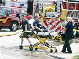 A firefighter is taken to the hospital after sustaining a minor injury battling the blaze.
