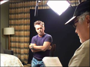 John Mellencamp, left, speaks with Toledo homeless advocate Ken Leslie at Caesars Windsor.