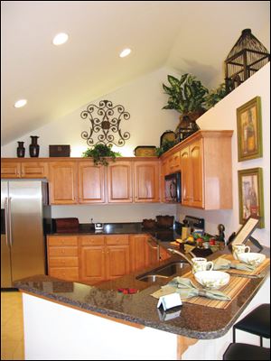 This impressive kitchen, with its soaring ceiling, can be customized to your taste with a choice of cabinets, finishes, countertops and more. 