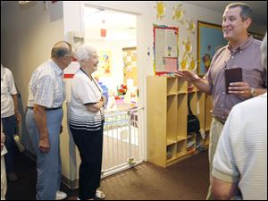 Rev. Fortune shows off the church's preschool area. It also has a school for kindergarten through eighth grade.